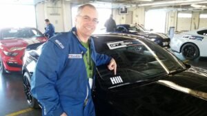 Randy at Ford driving school with his assigned racecar