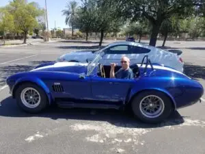 Randy driving a friends sports car